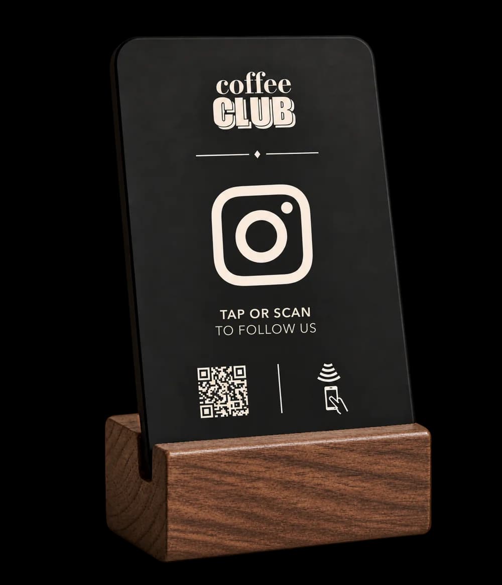 Round Instagram stand in charcoal black with a walnut base