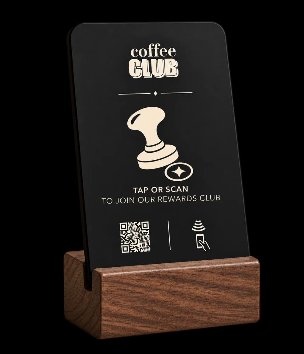Loyalty stand in charcoal black with example branding and a wooden base
